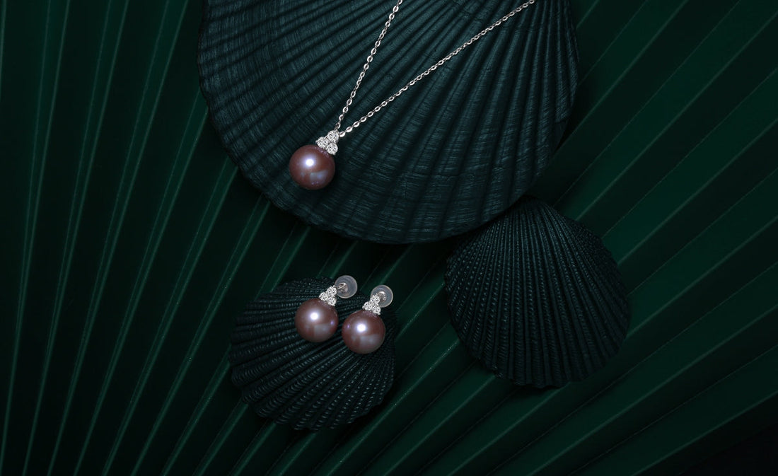 Lavender pearl necklace and matching earrings from Timeless Pearl symbolizing heirloom elegance.