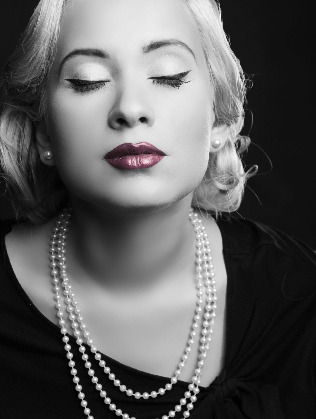 Timeless Pearl layered pearl necklace with matching studs, styled with vintage waves and bold red lips.