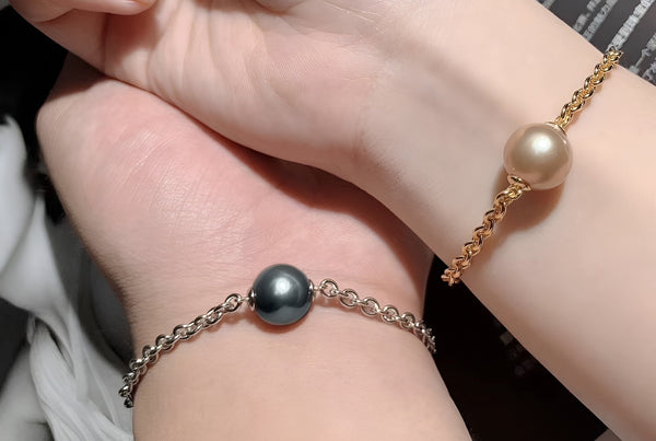  Timeless Pearl bracelets with radiating pearls worn by two friends.