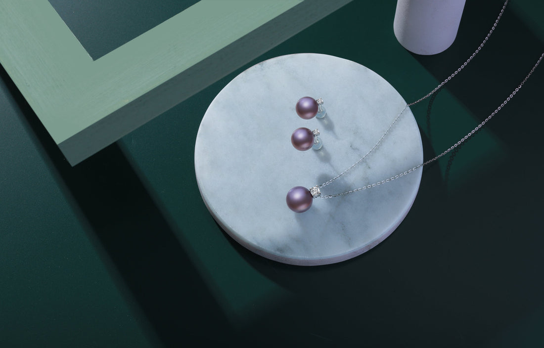 A Timeless Pearl necklace and earring pair placed delicately.