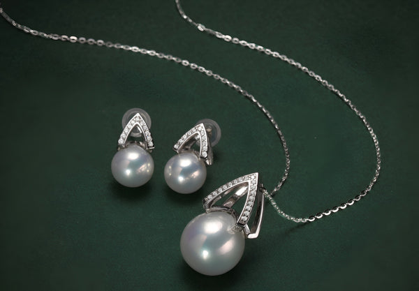 Timeless Pearl pearl pendant necklace and matching earrings with silver crystal accents.