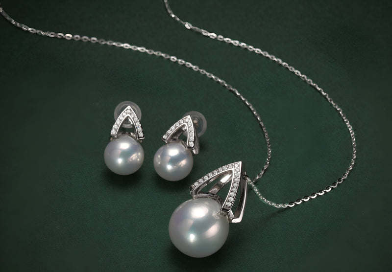 Timeless Pearl pearl pendant necklace and matching earrings with silver crystal accents.