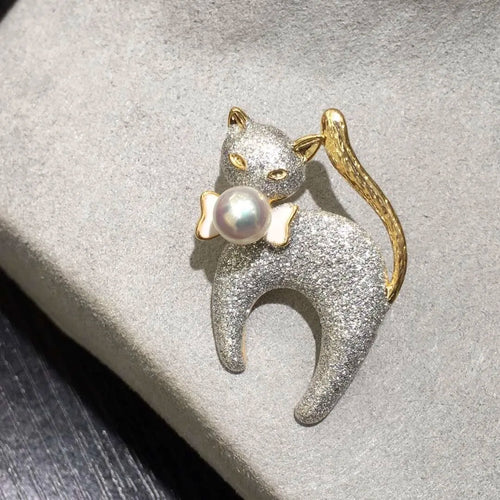 Silver glitter cat brooch with gold accents and a pearl by Timeless Pearls.