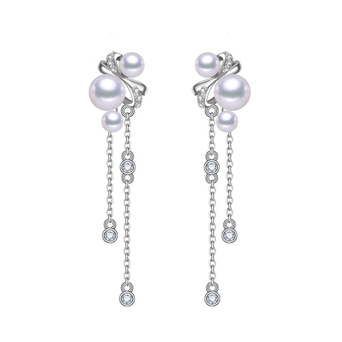 Silver earrings featuring multiple pink freshwater pearls and dangling crystal accents in a swirling design